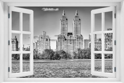 Fototapeta Naklejka Na Ścianę Okno 3D - Buildings of Manhattan along Central Park lake, New York City in a beautiful winter morning