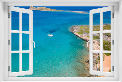 Fototapeta Naklejka Na Ścianę Okno 3D - Aerial view of a small beach and clear, blue ocean on the Greek island of Crete