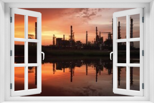 oil refinery during sunset, industrial machinery is set against a clear sky. generative ai