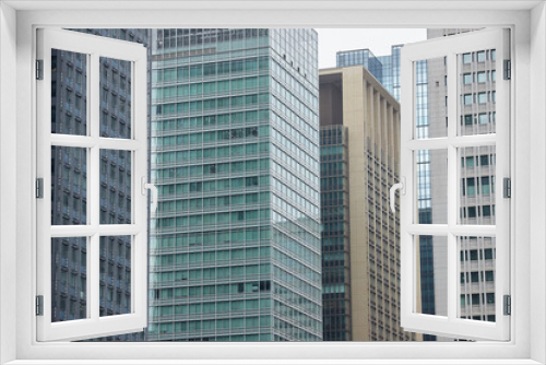 Fototapeta Naklejka Na Ścianę Okno 3D - 東京都の高層オフィスビルの外壁の風景