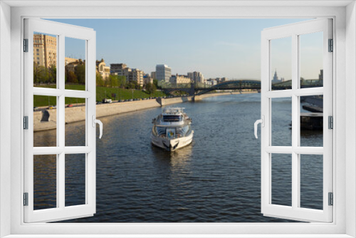 Fototapeta Naklejka Na Ścianę Okno 3D - View of the embankment of the Moscow River with a pleasure boat.