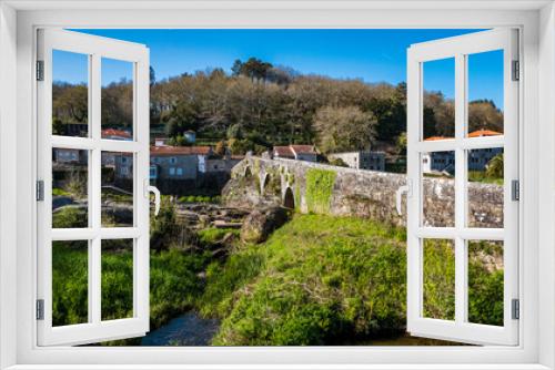 Fototapeta Naklejka Na Ścianę Okno 3D - A Ponte Maceira, Galicia, Spain - April 4, 2023: Roman stone bridge over the River Tambre