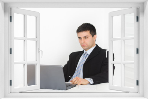 Businessman looking at laptop