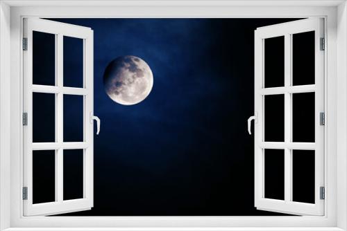 The moon is in space, on a dark background. Elements of this image furnished NASA.