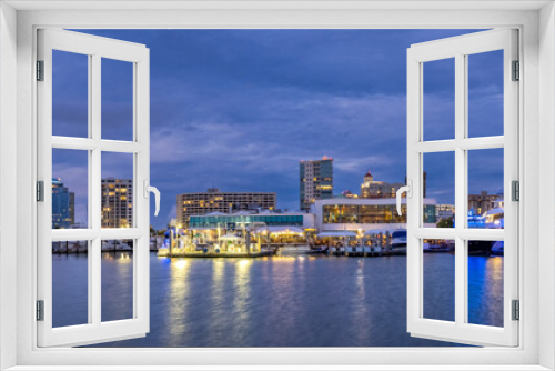 City skyline from Bayfront Park over Sarasota Bay at night in Sarasota Florida USA