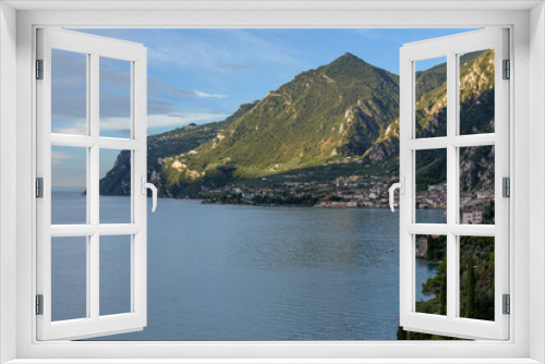 Fototapeta Naklejka Na Ścianę Okno 3D - City of Riva del Garda by Garda lake in Italy. View from the lake shore