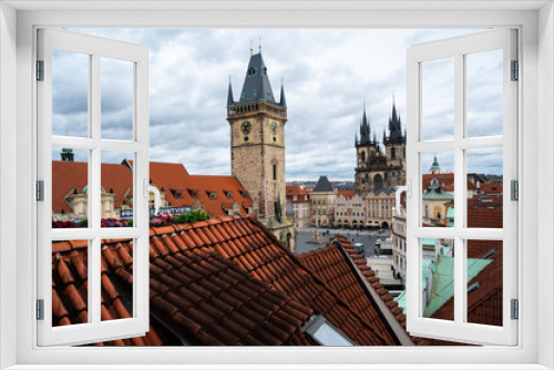 Panorama of Prague city with medieval , old architecture, Cathedrals, gothic towers and spires. landscape of Praga, view on the town with red roofs on houses and top landmarks.
