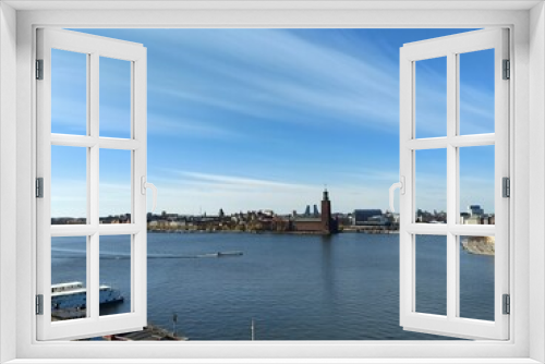 Fototapeta Naklejka Na Ścianę Okno 3D - Panoramic view of Gamla Stan - the old town of Stockholm against the backdrop of water and blue sky.