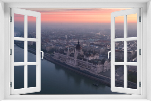 Aerial view of Hungarian Parliament Building at sunrise with the Danube river, in Budapest, Hungary