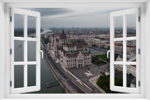 Fototapeta Naklejka Na Ścianę Okno 3D - Amazing Skyline Establishing Bird Eye Aerial View Shot of Budapest city. Hungarian Parliament Building with the Danube river at sunrise. Hungary