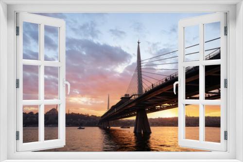 Fototapeta Naklejka Na Ścianę Okno 3D - Halic Metro Bridge in Istanbul. Modern cable bridge. Beautiful sunset view on Golden Horn.