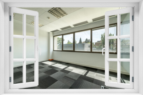 Fototapeta Naklejka Na Ścianę Okno 3D - empty offices with separate offices with glass partitions, large windows