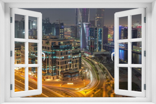Fototapeta Naklejka Na Ścianę Okno 3D - Bay Square district day to night timelapse with mixed use and low rise complex office buildings located in Business Bay in Dubai