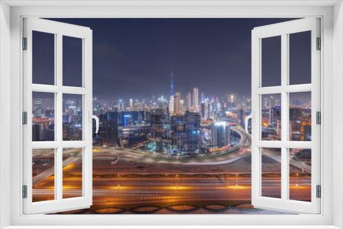 Fototapeta Naklejka Na Ścianę Okno 3D - Panoramic skyline of Dubai with business bay and downtown district day to night timelapse.