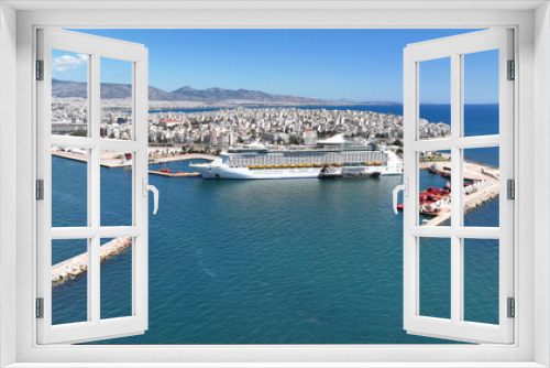 Fototapeta Naklejka Na Ścianę Okno 3D - Aerial drone photo of crowded cruise liner ship with pool facilities anchored in Port of Piraeus, Attica, Greece