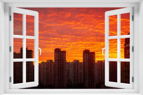 Colorful sunset in red among the sleeping area of high-rise buildings