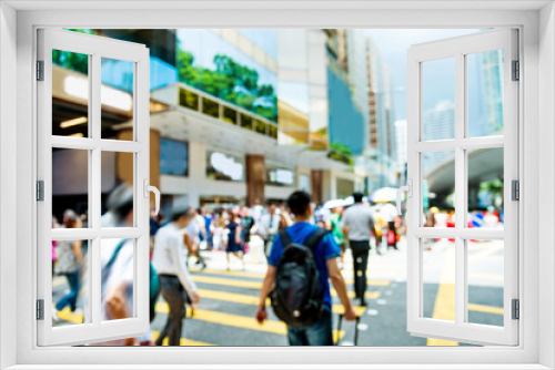 Blurred people walking down the street