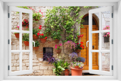 Fototapeta Naklejka Na Ścianę Okno 3D - Colorful flowers outside a home in Assisi, Italy