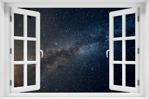 Fototapeta Naklejka Na Ścianę Okno 3D - Beautiful shot of Milky Way illuminating a dark night sky