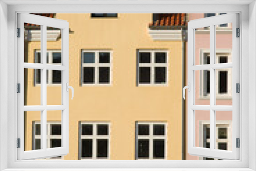 Fototapeta Naklejka Na Ścianę Okno 3D - Yellow historic terraced house in Nyhavn in the center of Copenhagen in Denmark