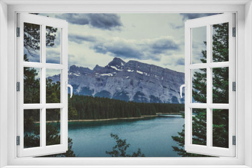 Fototapeta Naklejka Na Ścianę Okno 3D - Lake Louise, Banff National Park, Alberta, Canada. The lake is located in the Canadian Rockies. panorama of snow-capped mountain peaks, coniferous forest and blue glacial lake, cloudy day. 