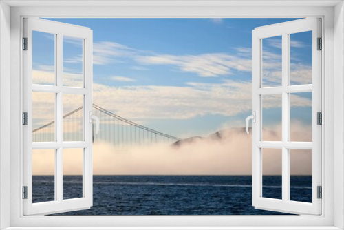Fototapeta Naklejka Na Ścianę Okno 3D - Beautiful foggy view of the Golden Gate Bridge in San Francisco with blue sky