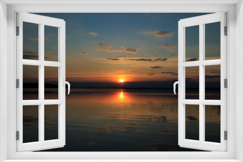 Evening landscape, sunrise or sunset on the lake or the sea