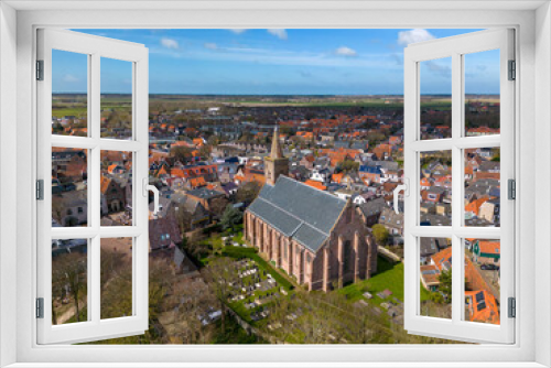 Fototapeta Naklejka Na Ścianę Okno 3D - This aerial drone photo shows the old city center of Den Burg with a beautiful church. Den Burg is the capital of Texel, an island in the Wadden Sea, the Netherlands. 