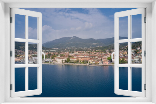 Fototapeta Naklejka Na Ścianę Okno 3D - View of the historic part of Salò on Lake Garda Italy. Tourist site on Lake Garda. Lake in the mountains of Italy. Aerial view of the town on Lake Garda.