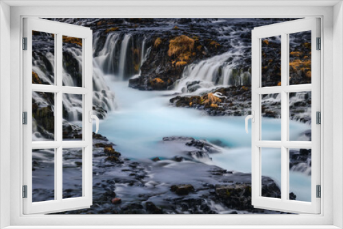 Fototapeta Naklejka Na Ścianę Okno 3D - Bruarfoss waterfall and its surroundings captured on a winter afternoon in Iceland.