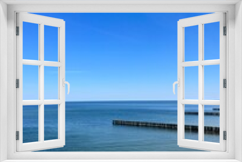 Fototapeta Naklejka Na Ścianę Okno 3D - Blue transparent sea surface, blue sea horizon, clear blue sky