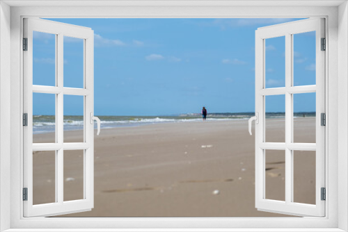 Fototapeta Naklejka Na Ścianę Okno 3D - Woman walking on the beach in Le Touquet, France