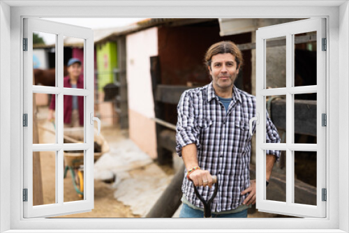 Middle aged european male farmer working with tools