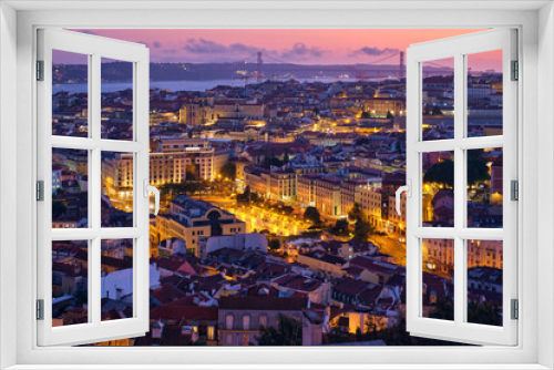 Fototapeta Naklejka Na Ścianę Okno 3D - Evening aerial view of Lisbon famous view from Miradouro da Senhora do Monte tourist viewpoint of Alfama and Mauraria old city districts, 25th of April Bridge in the evening twilight. Lisbon, Portugal