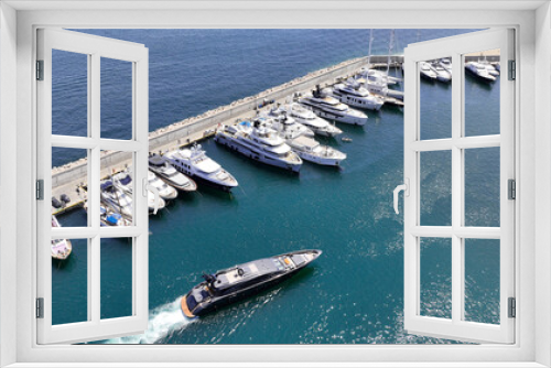 Fototapeta Naklejka Na Ścianę Okno 3D - Aerial drone photo of beautiful yacht manoeuvring inside round port of Zea or Passalimani a safe anchorage in seaside area of Piraeus, Attica, Greece