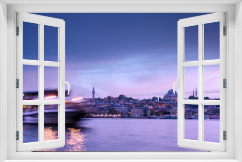 Fototapeta Naklejka Na Ścianę Okno 3D - Istanbul cityscape - panoramic scenic view of mosque with ferry boat at sunset. Long exposure landscape of Istanbul at night