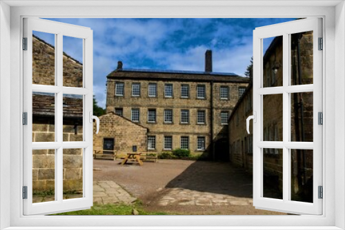 Fototapeta Naklejka Na Ścianę Okno 3D - Landscape of stone Gibson Mill Museum in Calder Valley England under blue sky