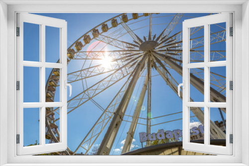Fototapeta Naklejka Na Ścianę Okno 3D - Ferris wheel Budapest Eye at Erzsebet Square in Budapest city, hungary, in early spring