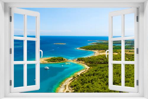 Fototapeta Naklejka Na Ścianę Okno 3D - View from the air on the sea and coast. Sea relaxation and travel. The forest near the sea. Azure water on the sea. A bright sunny day during a summer vacation.