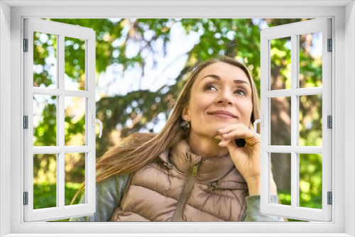 Seizing the day, her smile to the camera radiates joy in the park.