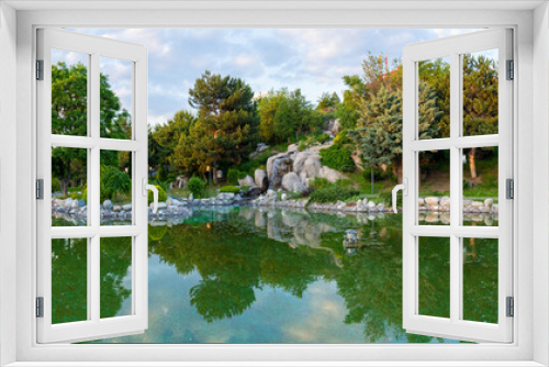 Fototapeta Naklejka Na Ścianę Okno 3D - The panoramic view of the artificial pond in Ankara 50th Year Park (50. Yil Parki).