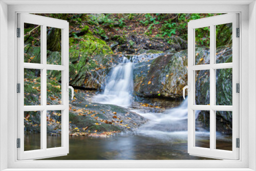 Fototapeta Naklejka Na Ścianę Okno 3D - Waterfall with silky, smooth water in the Adirondack Mountains, Upstate New York, USA.