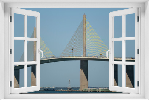 Fototapeta Naklejka Na Ścianę Okno 3D - Sunshine Skyway Bridge over Tampa Bay in Florida with moving traffic. Concept of transportation infrastructure