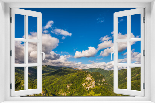 Fototapeta Naklejka Na Ścianę Okno 3D - Green Hills Under Blue Sky with Clouds