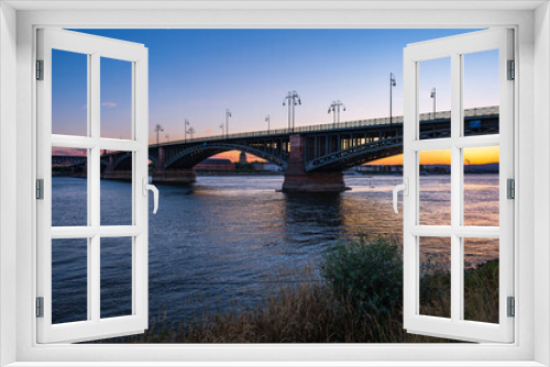 Fototapeta Naklejka Na Ścianę Okno 3D - View of the Theodor Heuss Bridge over the Rhine between Mainz and Wiesbaden/Germany at sunset