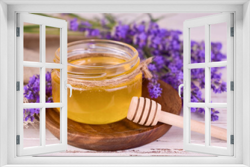 Fototapeta Naklejka Na Ścianę Okno 3D - Fresh fragrant lavender honey and lavender flowers on a wooden tray.	