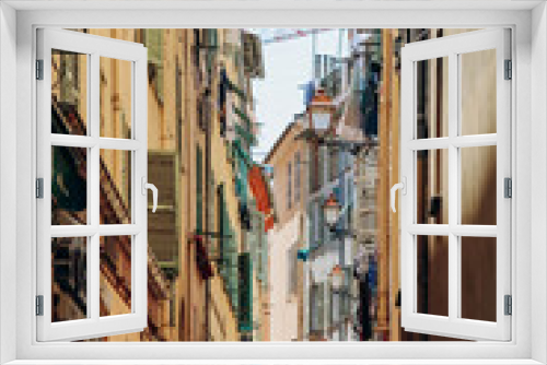 Fototapeta Naklejka Na Ścianę Okno 3D - Nice, France - 25 June 2023: Picturesque street in Old Nice