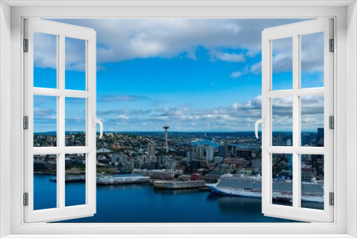 Fototapeta Naklejka Na Ścianę Okno 3D - View of A skyline featuring two cruise ships docked at the marina