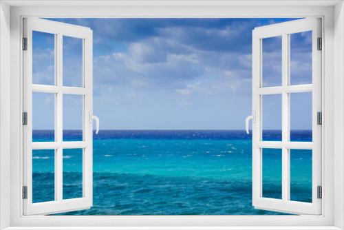 Fototapeta Naklejka Na Ścianę Okno 3D - View in Greece of mediterranean sea with blue hues and cloudy sky
