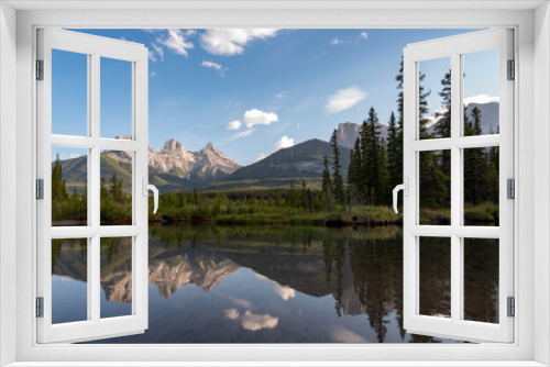 Fototapeta Naklejka Na Ścianę Okno 3D - Incredible nature scenery outside of Banff National Park during summer time with iconic Three Sisters in view on sunset, golden hour afternoon. 